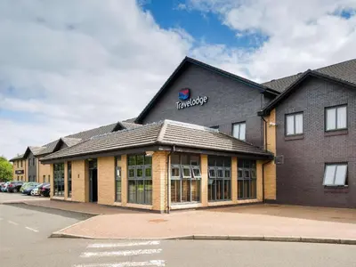 a building with a sign on the side of it at Travelodge Glasgow Airport in Glasgow