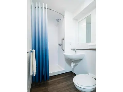 a bathroom with a toilet and a sink at Travelodge Edinburgh Dreghorn in Edinburgh