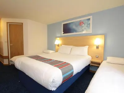 a hotel room with two beds at Travelodge Edinburgh Dreghorn in Edinburgh