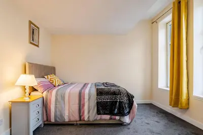 a bedroom with a bed and a window at Cosy Retreat - Suite 5 in Hamilton
