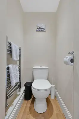 a bathroom with a white toilet in a room at Great location Edinburgh city centre in Edinburgh