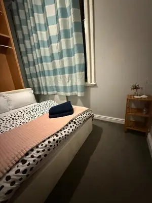 a bedroom with a bed and a window at Flat in the heart of Liverpool city centre in Moffat