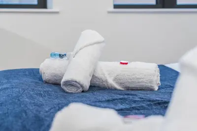 a pile of toilet paper on a blue towel at Central Jewellery Quarter 1-Bedroom with Parking in Moffat