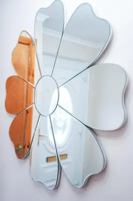 a glass butterfly wall decoration on a white surface at Jake's House in Airdrie