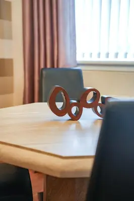 a pair of scissors sitting on top of a table at Jake's House in Airdrie