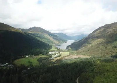 a view of a valley with a river and mountains at 3 Bed House - Mountain Views Bbq Firepit in Dunoon