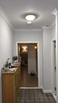 a room with a hallway with a desk and a hallway at Edinburgh West Residence in Edinburgh