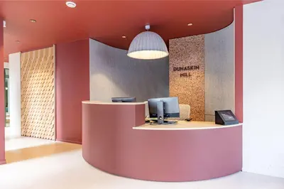 a lobby with a desk with a computer on it at For Students Only - Dunaskin Mill in Glasgow in Glasgow