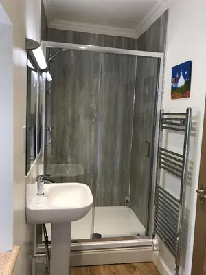 a bathroom with a shower and a sink at Ederline Farm Cottage in Lochgilphead