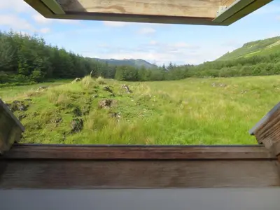 a view of a field from a window at Finchairn Cottage in Lochgilphead