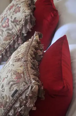 two pillows sitting on top of a bed at Finchairn Farmhouse in Lochgilphead