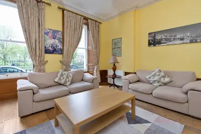a living room with two couches and a coffee table at Gardners Crescent in Edinburgh