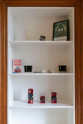 a white shelf with some items on it at Gardners Crescent in Edinburgh