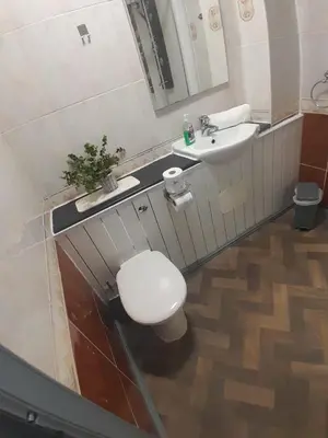 a bathroom with a toilet and a sink at Warm Central Apartment by Meadows 7 in Edinburgh