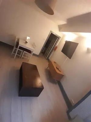 an overhead view of a living room with a table and a desk at Warm Central Apartment by Meadows 7 in Edinburgh