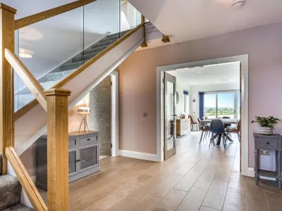 a staircase in a home with a living room at A'chrannchuir in Blackwaterfoot