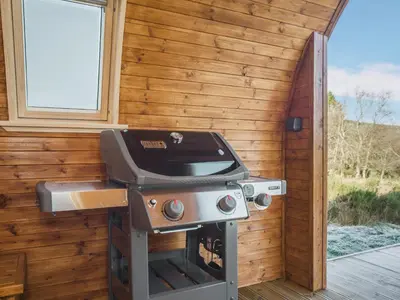 a grill in a cabin with a wooden wall at Here - Uk50566 in Port of Menteith