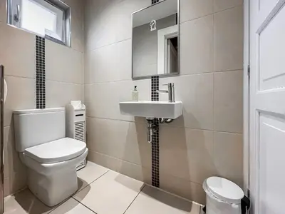 a bathroom with a toilet and a sink at Lodge 4 - Uk51264 in Glasgow
