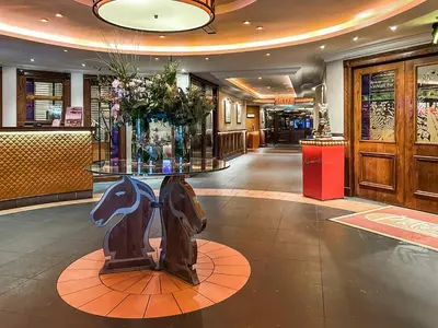 a lobby with a table with flowers on it at Lodge 4 - Uk51264 in Glasgow