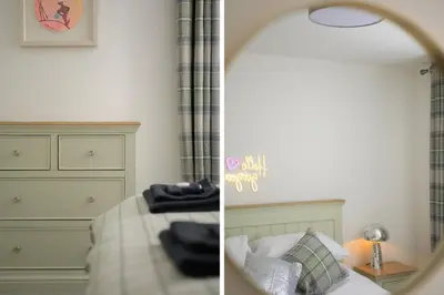 a bedroom with a bed and a mirror at Historic 1BR Home in Culross Near Filming Sites in Culross