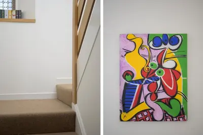 a painting on the wall next to a set of stairs at Historic 1BR Home in Culross Near Filming Sites in Culross
