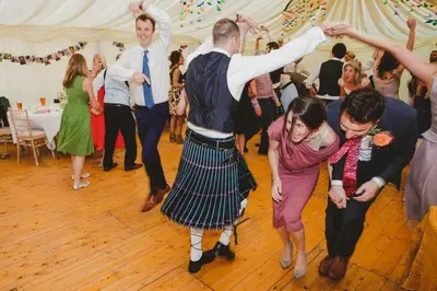 a group of people on the dance floor at a wedding at Argyll Country House in Clachan