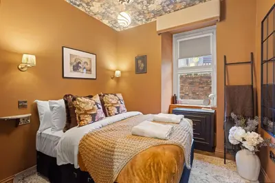a bedroom with a bed and a window at Boutique Studio Near Stirling in Cambusbarron