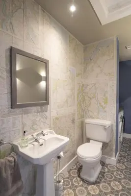 a bathroom with a white toilet and a sink at The Steading In The Park in Stirling