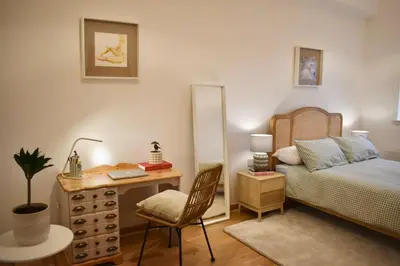 a bedroom with a bed and a desk and a chair at Luxury Historic City-Centre Flat & Free Parking in Glasgow