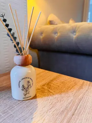 a vase with sticks in it on a table at Anchor stays - your steady base away from home in Cambusnethan
