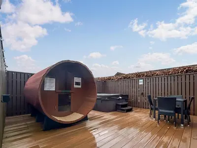a wooden deck with a wooden table and a wooden fence at Conemara - Uk51249 in Glasgow