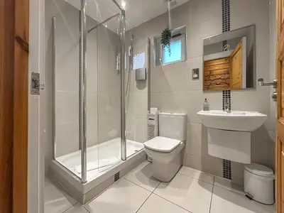 a bathroom with a shower and a toilet and a sink at Lodge 2 - Uk51263 in Glasgow