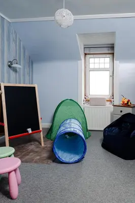 a room with a tent and a tv in it at Fir Tree Lodge - Seasgair Lodges in Crieff