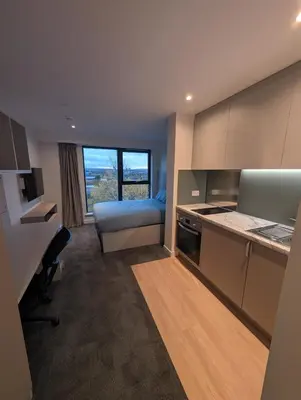 a kitchen with a bed and a desk in a room at For Students Only West End in Glasgow in Glasgow