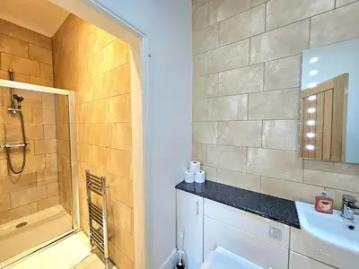 a bathroom with a shower and a sink at Stellar Apartments - 2 & 3 Bedroom Apartments in Edinburgh