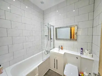 a bathroom with a tub and a toilet and a sink at Stellar Apartments - 2 & 3 Bedroom Apartments in Edinburgh