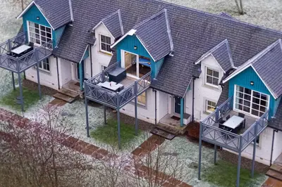 an aerial view of a house with blue at Gleneagles Hideaway