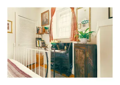 a room with a desk and a staircase with a window at Historic Hideaway - Dean Village in Edinburgh