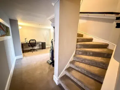 a stairway leading to a room with a desk at Spacious Three Storey West End Home - 3 bedroom in Glasgow