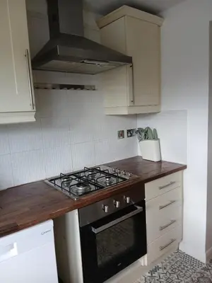 a kitchen with a stove top oven in a kitchen at Fabulous 4 Bed House in Leiston in Moffat