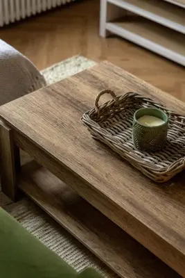 a coffee table with a cup of coffee on it at Cosy Callander One Bed Apartment Wood Burner and Free Parking in Callander