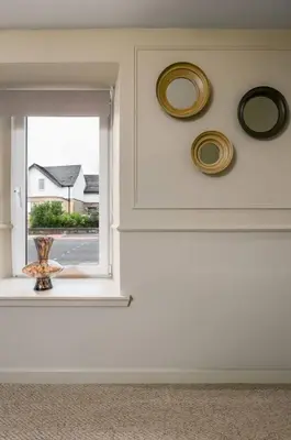 a room with a window with plates on the wall at The Bruces Quarter in Stirling