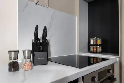 a kitchen counter with a knife block on it at Caledonia Suite by The Wallace Monument in Stirling