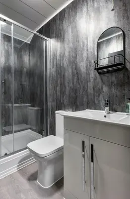 a bathroom with a toilet and a sink and a shower at The Wallace Suite by The Wallace Monument in Stirling