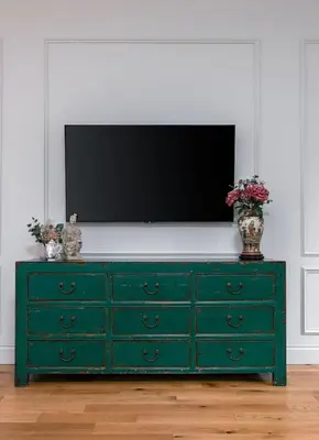 a green dresser with a television on top of it at Kings Park Garden Cottage - Free Parking in Stirling