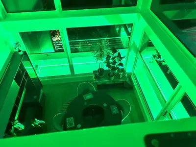 an overhead view of a living room with green lighting at Duplex Penthouse with Secured Parking Finnieston in Glasgow