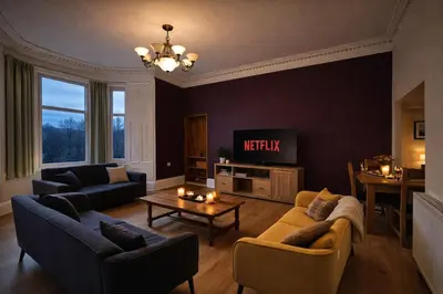 a living room with two couches and a tv at Contractors and Guests Grand 3 Bedroom Central Free Parking Fully equipped in Glasgow