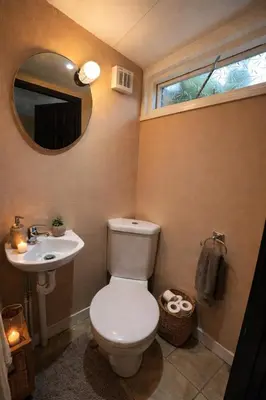 a bathroom with a toilet and a sink and a mirror at Comfortable 3 Bed Home with Garden & Parking Stylish Family Contractor in Newton Mearns