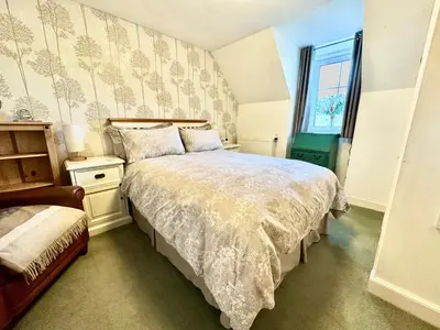 a bedroom with a bed and a window at Craig Na Barnach in Furnace