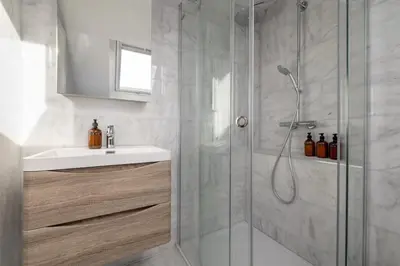 a bathroom with a shower and a sink at Barnton Grove Getaway in Edinburgh